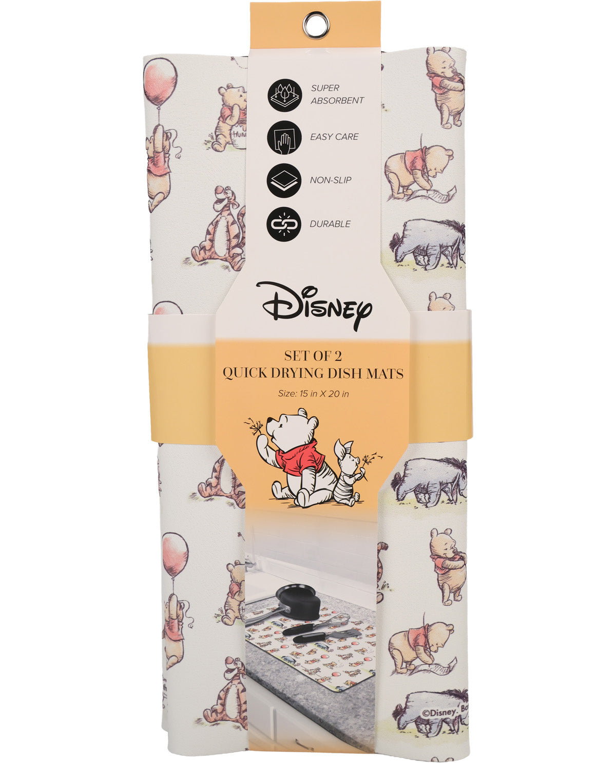 Packaged set of two Disney Winnie the Pooh quick-drying dish mats, featuring a white background with illustrations of Pooh, Tigger, and other characters, with a central orange label.