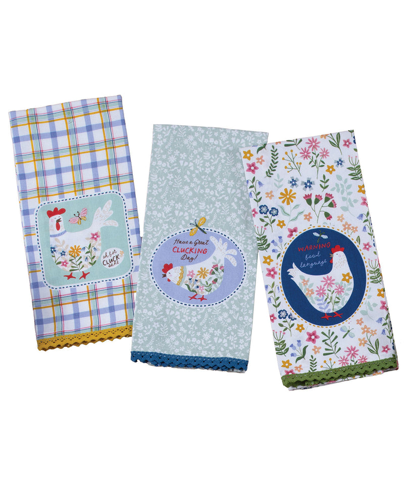 Three colorful kitchen towels with chicken designs on a white background