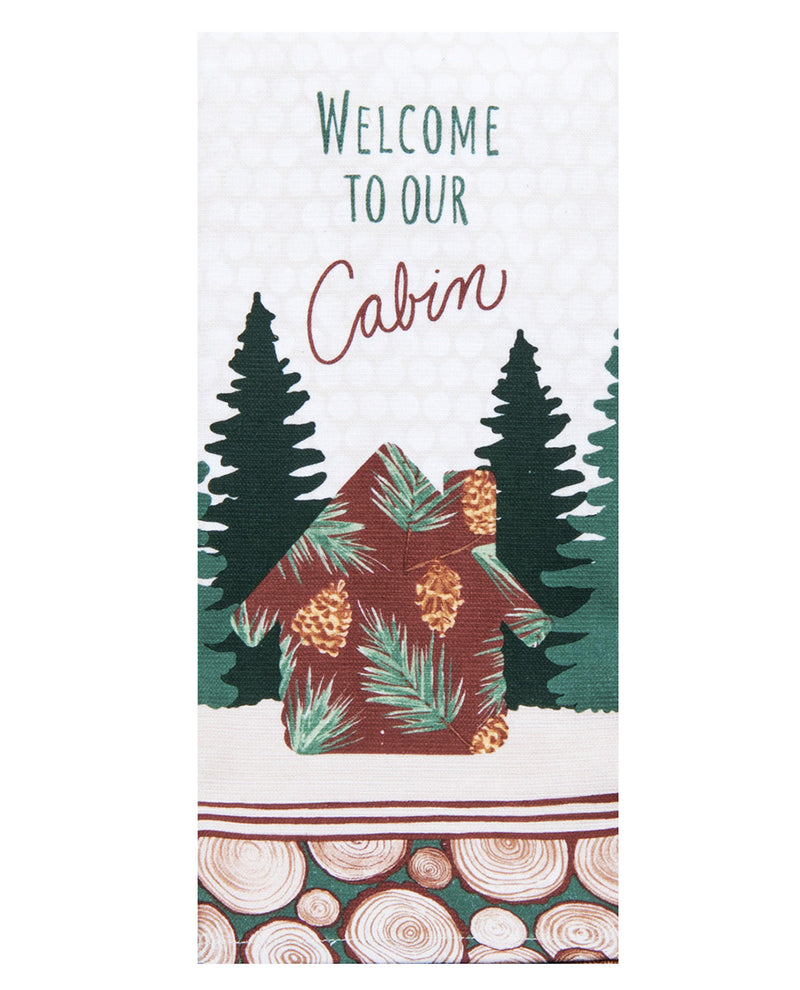 Decorative towel with cabin and forest design, featuring text 'Welcome to our Cabin'.