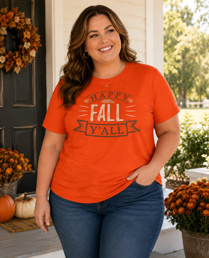 Woman wearing an orange 'Happy Fall Y'all' t-shirt on a porch with autumn decorations.