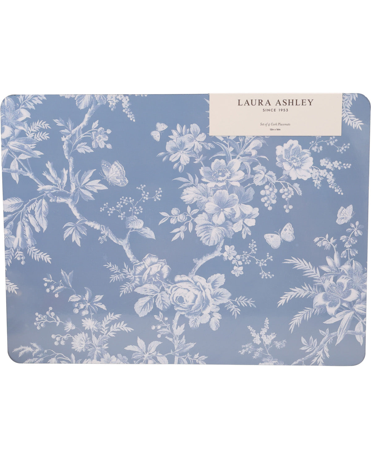 A rectangular Laura Ashley table mat featuring a classic blue and white floral toile pattern, with a cream paper label at the top right corner.