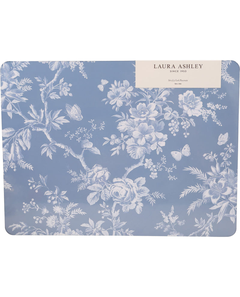 A rectangular Laura Ashley table mat featuring a classic blue and white floral toile pattern, with a cream paper label at the top right corner.