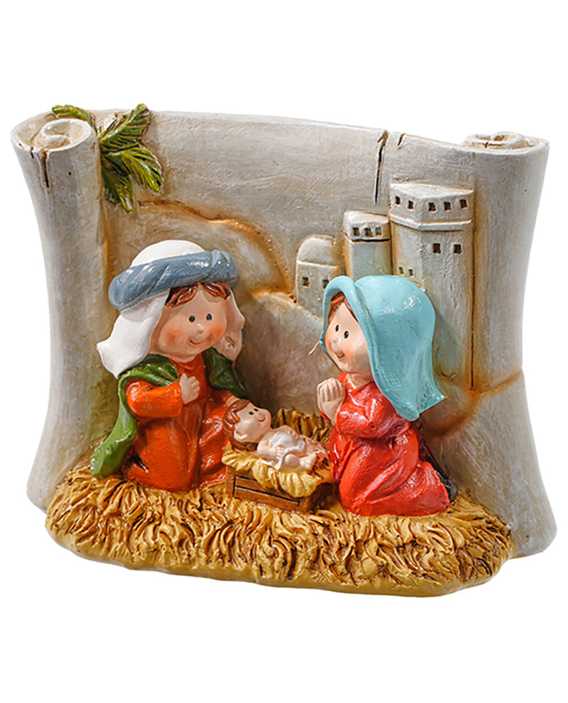 Decorative nativity scene with two children and a baby Jesus figure, set against a white background.