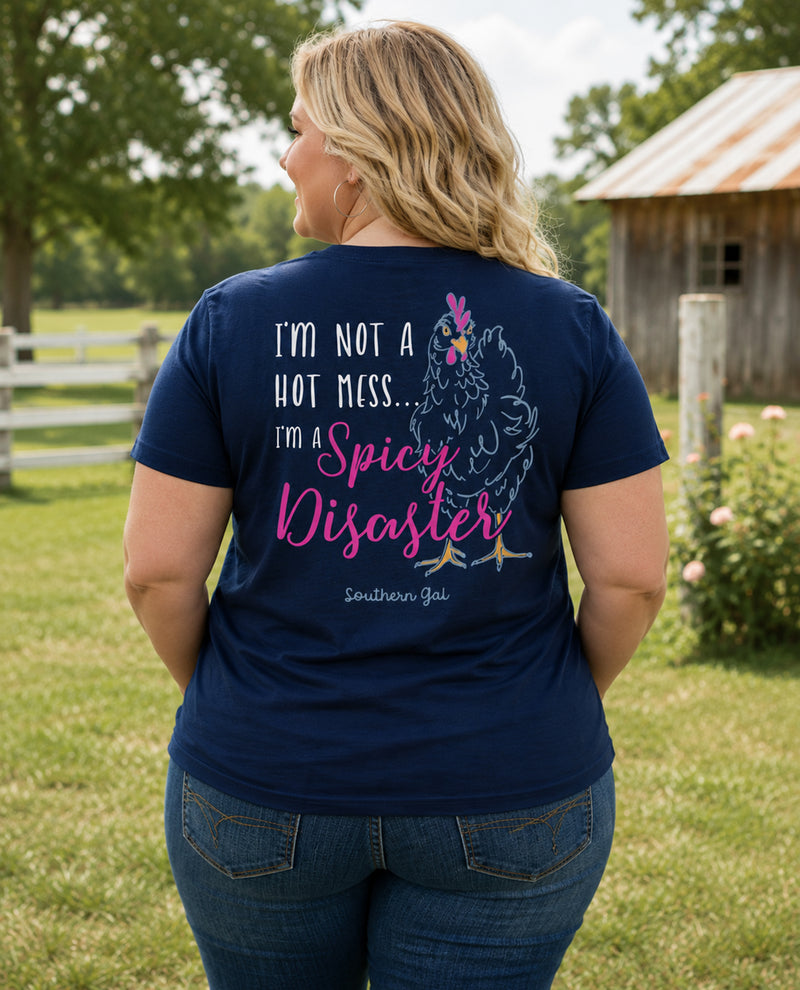 Person wearing a navy blue t-shirt with a graphic and text in an outdoor setting