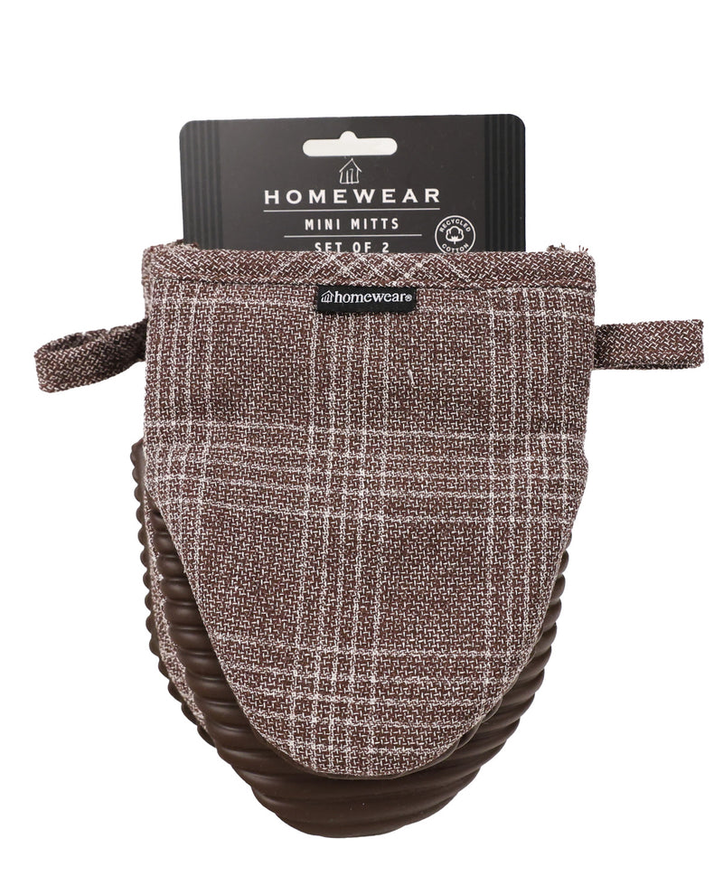 A set of two Homewear mini mitts in a brown and beige plaid tweed fabric, shown with their black cardboard retail hanger on a white background.
