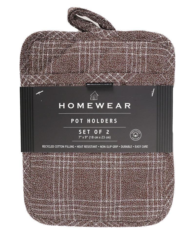 A set of two brown pot holders with a plaid pattern, wrapped in a black paper band labeled 'HOMEWEAR POT HOLDERS SET OF 2'.