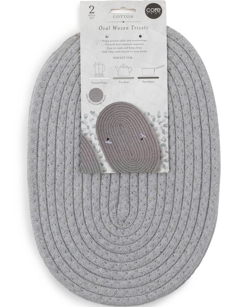 A gray oval woven tri-fold doormat with its original white cardboard packaging, featuring the brand name 'core' and product details.