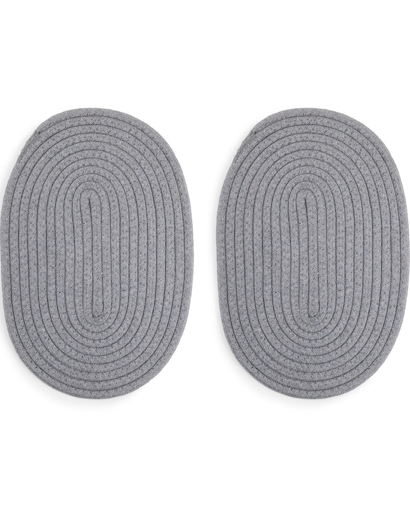 Two oval braided rug pucks in a heather gray color, shown side-by-side on a plain white background.