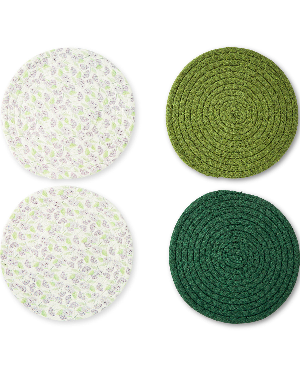 Four round woven placemats on a white background, including two green braided coasters and two white placemats with a green and gray floral pattern.