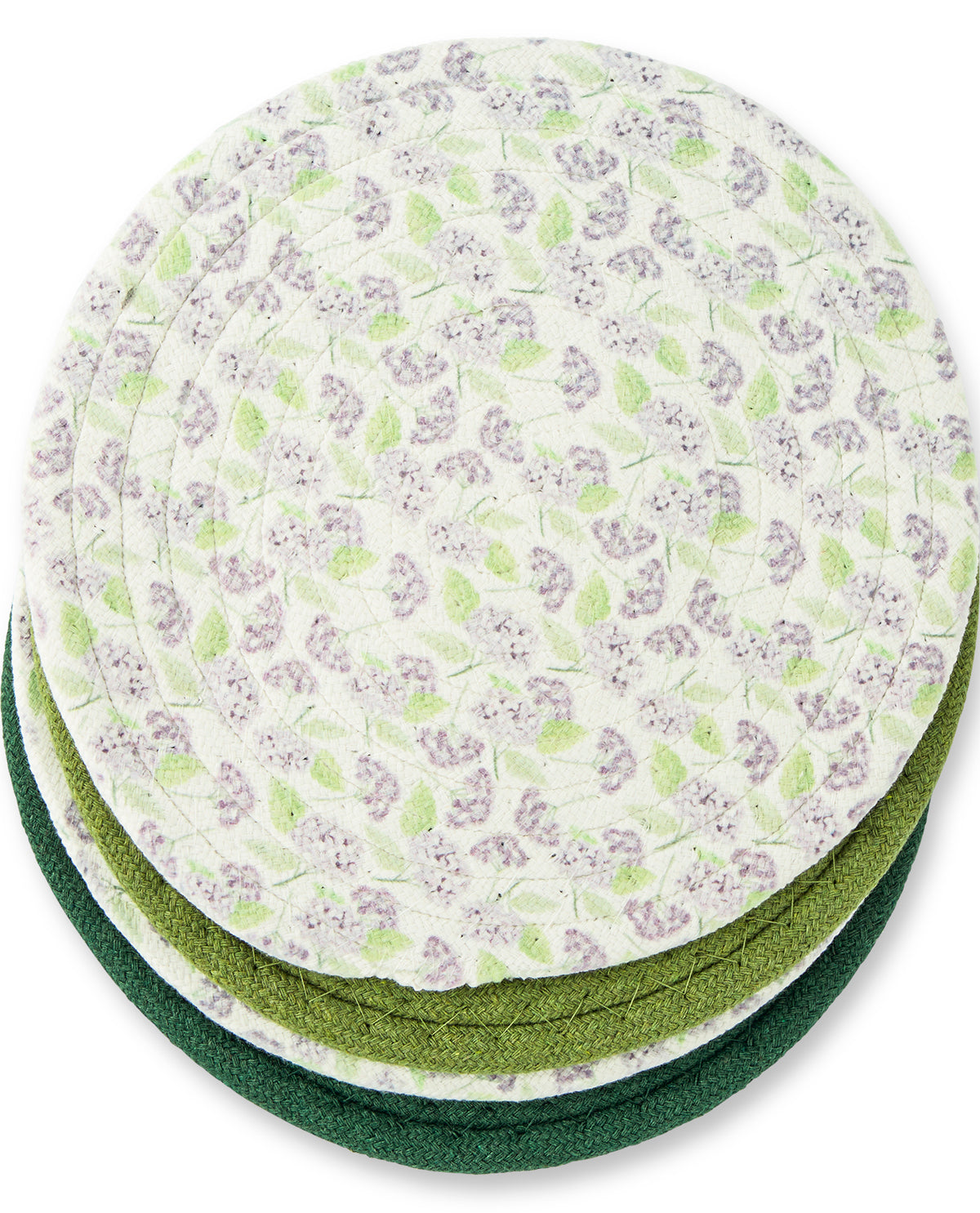 A stack of round quilted fabric coasters with a small floral pattern in light green and lavender on an off-white background, with two solid dark green coasters visible underneath.