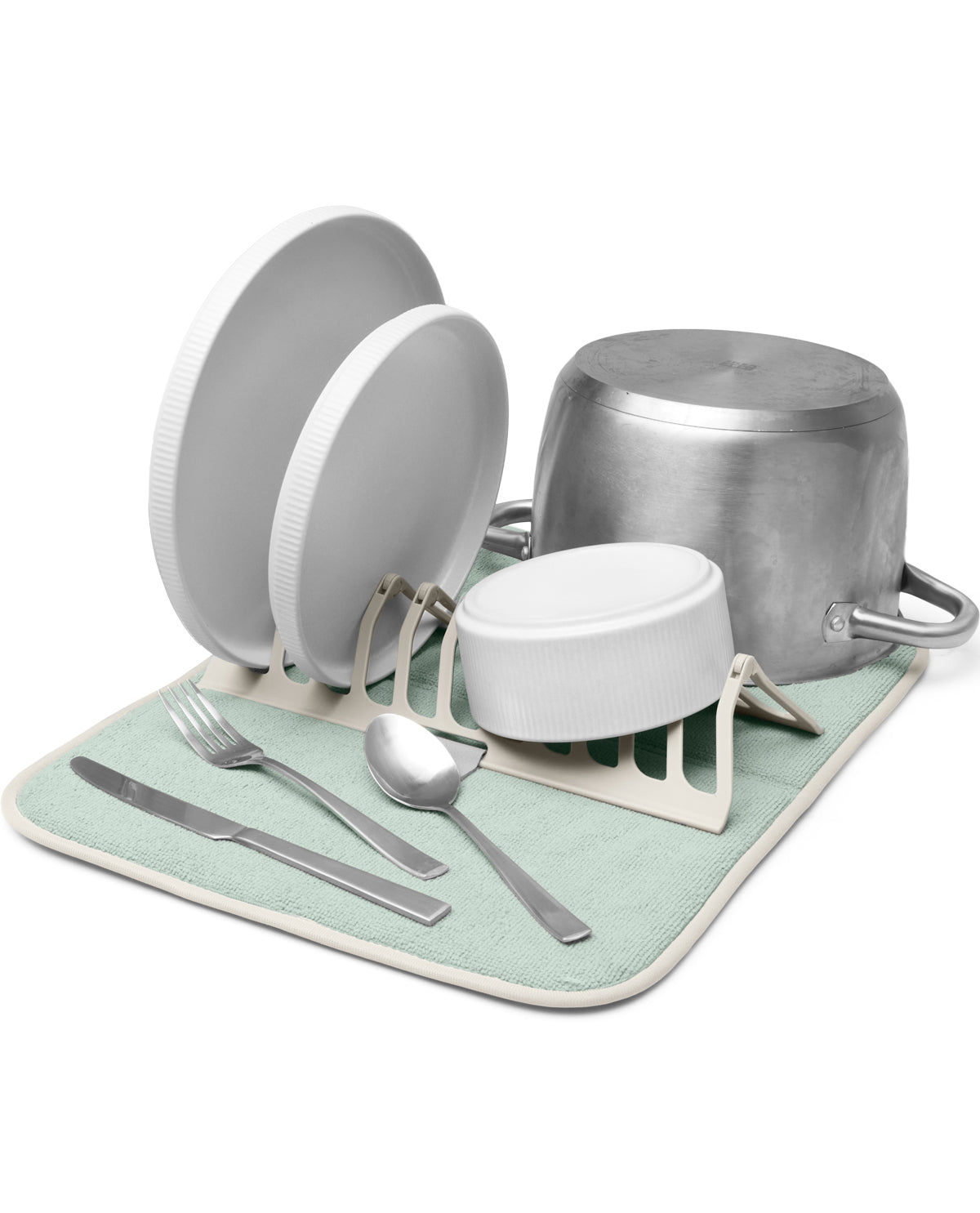 A dish drying rack set with a mint green and beige mat, holding white plates, a silver pot, a small white container, and silver utensils on a white background.