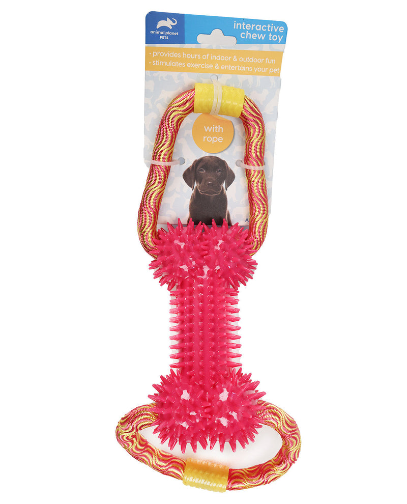 A packaged dog chew toy on a white background. The toy is a bright pink ribbed squeaker with a yellow and orange wavy rope attached at the top and a small yellow loop at the bottom.