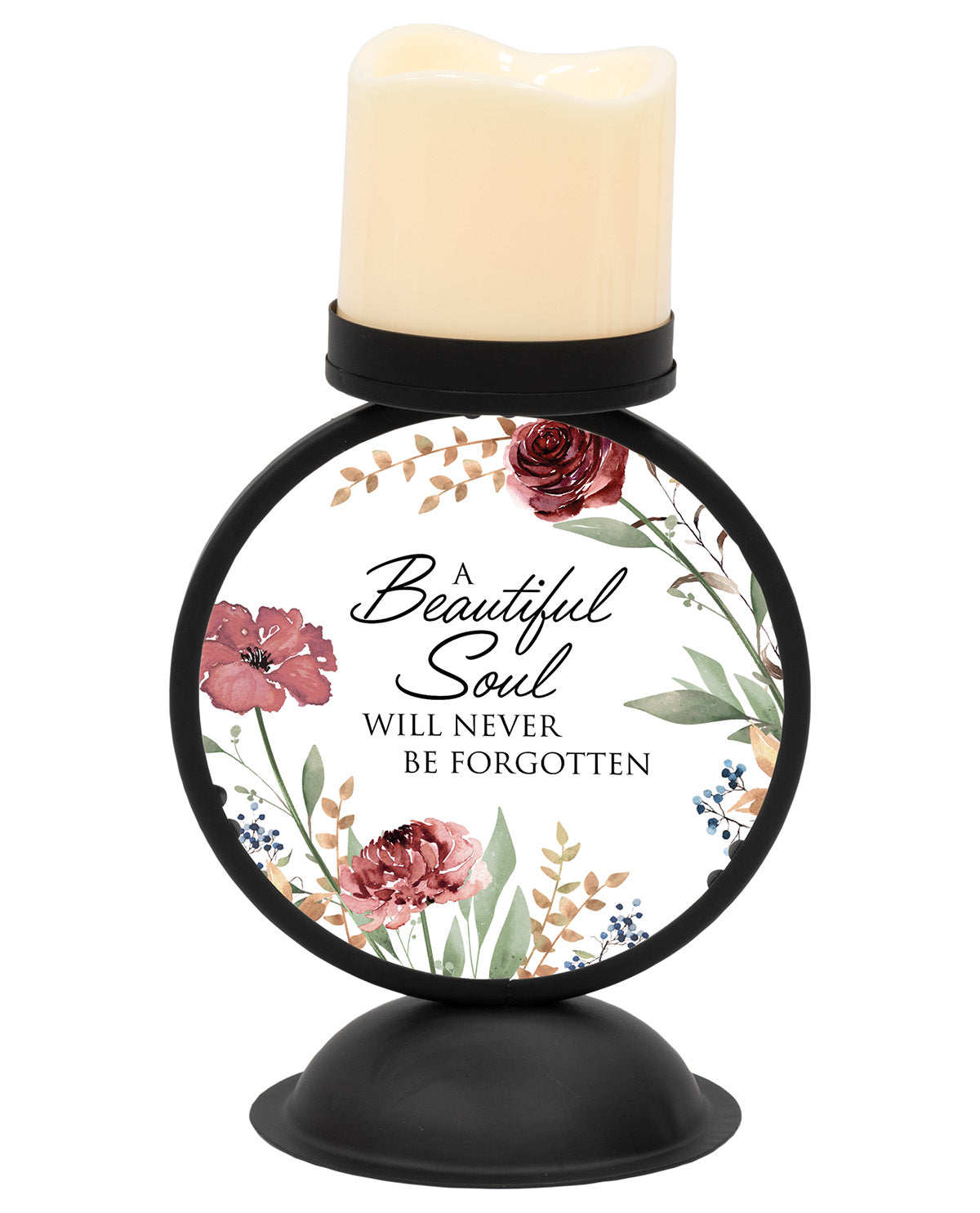 A memorial candle holder with a black metal base and a cream-colored candle. The circular front features a white label with a floral design and the text 'A Beautiful Soul WILL NEVER BE FORGOTTEN'.