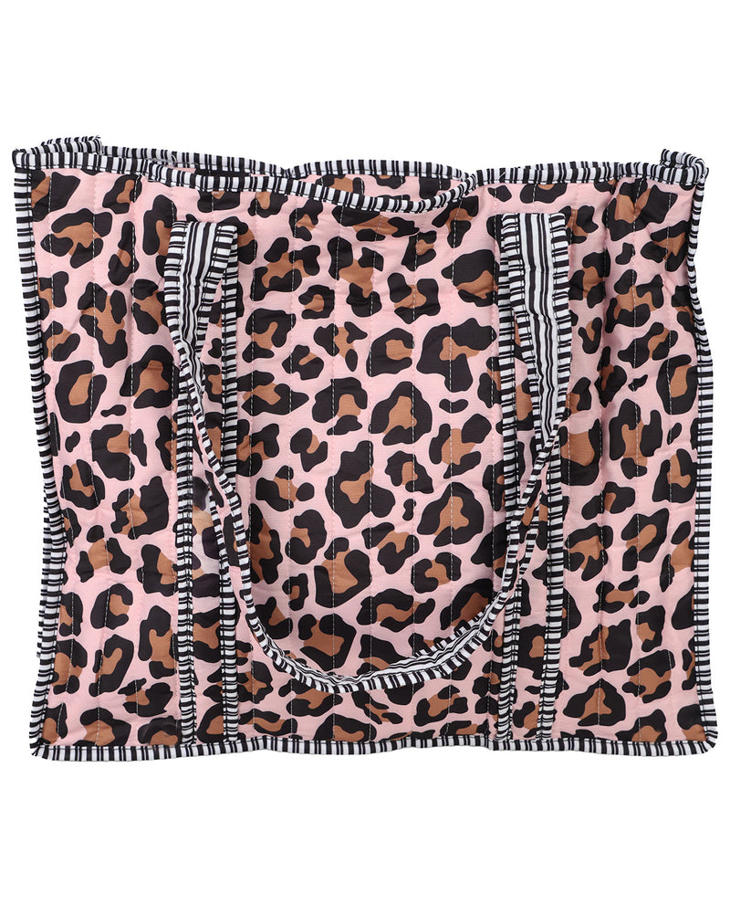A pink leopard print tote bag with black and white striped fringed handles and trim, shown flat against a white background.