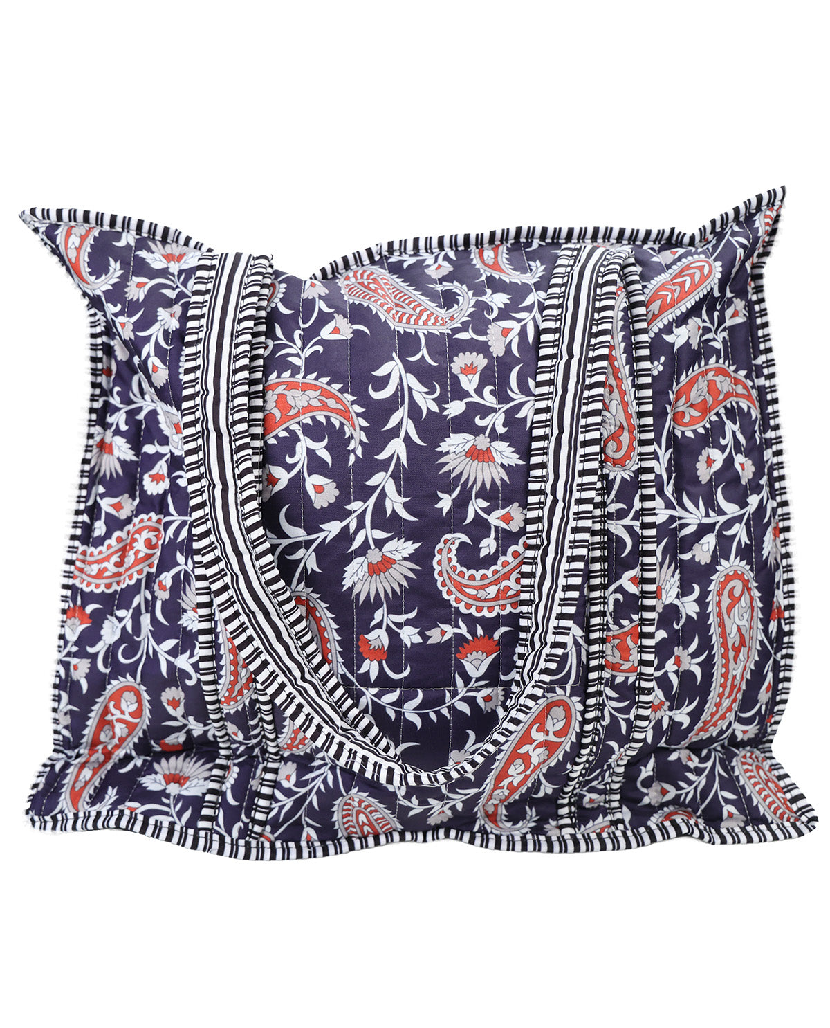 A square decorative tote bag with a navy blue background, featuring a white and orange paisley and floral block print, and finished with black and white striped ruffled trim.