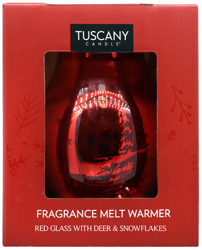 Tuscany Candle fragrance melt warmer in a red glass bottle with deer and snowflake designs, presented in its red retail box with a clear window.