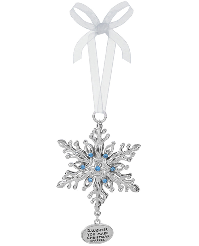 A silver snowflake Christmas ornament with blue rhinestone accents and a hanging silver tag that reads 'DAUGHTER, YOU MAKE CHRISTMAS SPLEEN.' It hangs from a white ribbon bow on a plain white background.