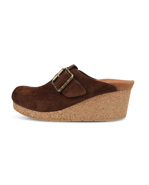 A single dark brown suede clog shoe with a cork wedge heel and a gold-tone buckle strap, shown in profile against a plain white background.