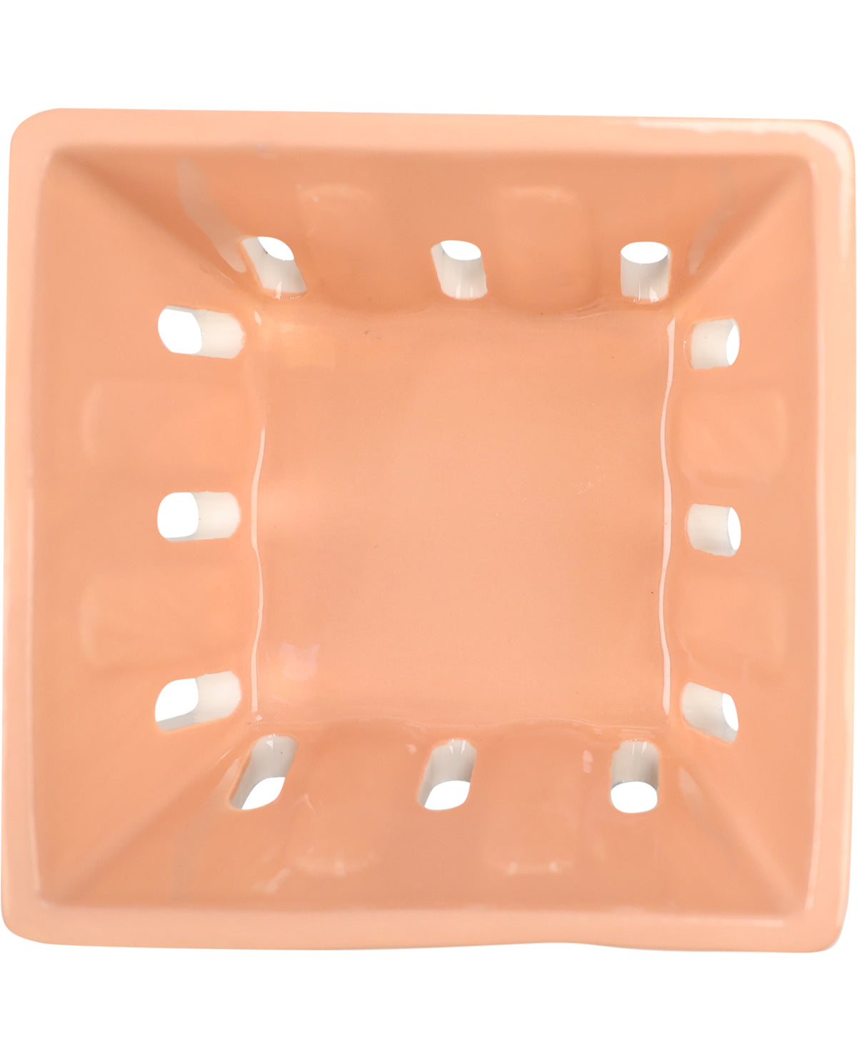 A square ceramic bowl with a glossy peach-orange finish and eight small cutout slots around the rim, shown from a top-down perspective on a white background.