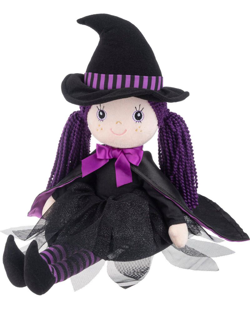 A witch doll plush toy with purple braided hair, a black pointed hat with purple stripes, a black dress, and a purple bow, shown against a plain white background.