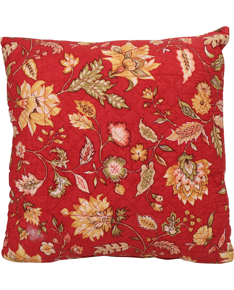 A square decorative throw pillow featuring a vibrant red background with an intricate floral and botanical pattern in shades of yellow, beige, and muted green.