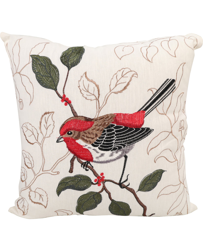 A square decorative throw pillow featuring an embroidered red bird perched on a branch with green leaves and small red berries, set against a cream background with light brown leaf outlines.