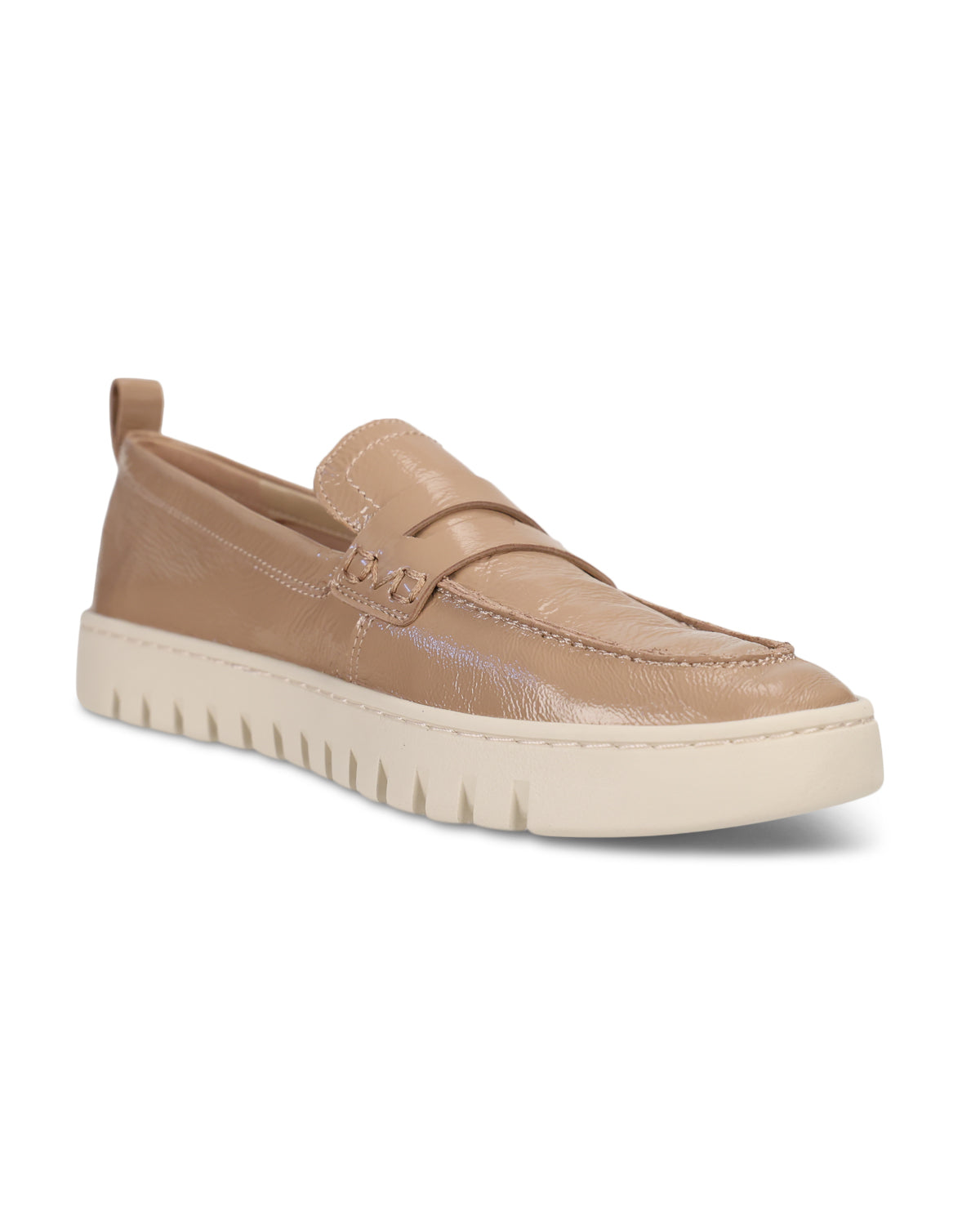 A single tan leather slip-on loafer with a textured embossed pattern, featuring a thick cream-colored platform sole with a ridged edge, shown against a plain white background.