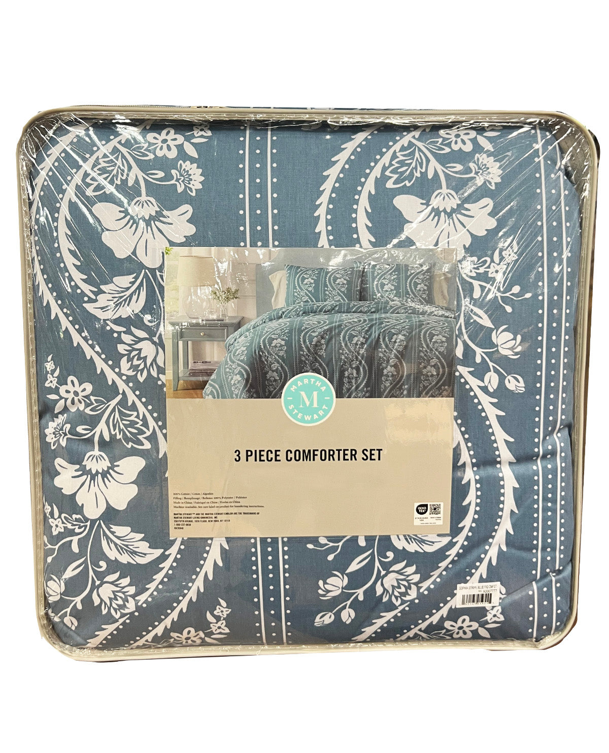 A packaged 3-piece comforter set with a slate blue and white floral paisley pattern, wrapped in clear plastic with a paper label in the center.