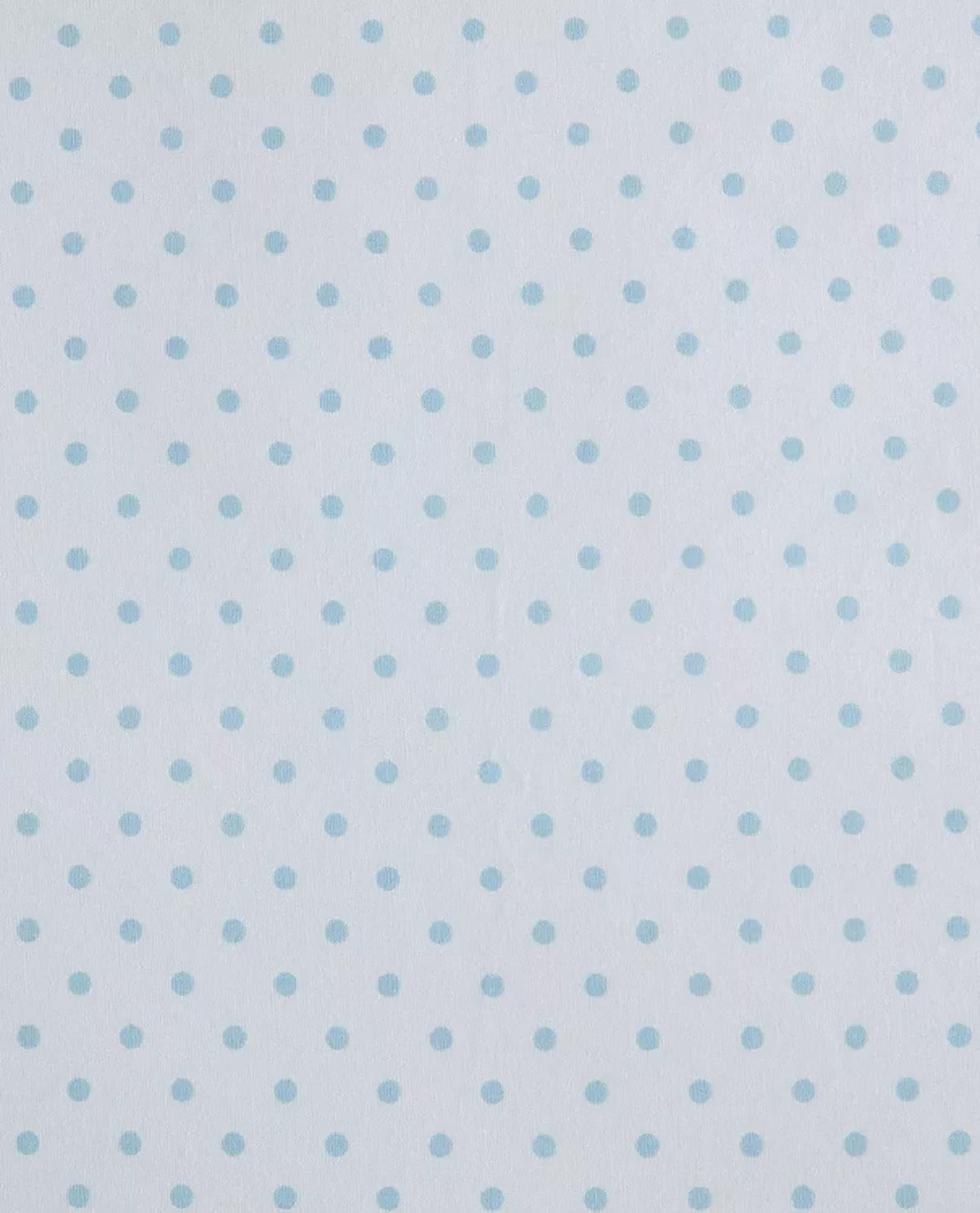 A close-up of a fabric or wallpaper pattern featuring small, evenly spaced light blue polka dots on a white background.