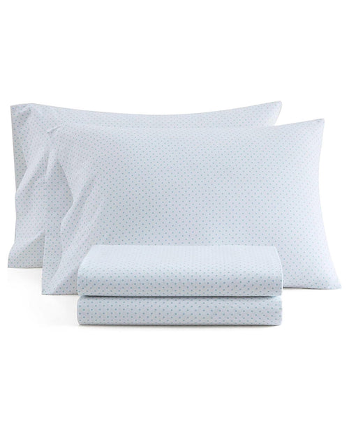 Two white pillowcases with a small blue geometric pattern, shown with a matching folded sheet on a solid white background.