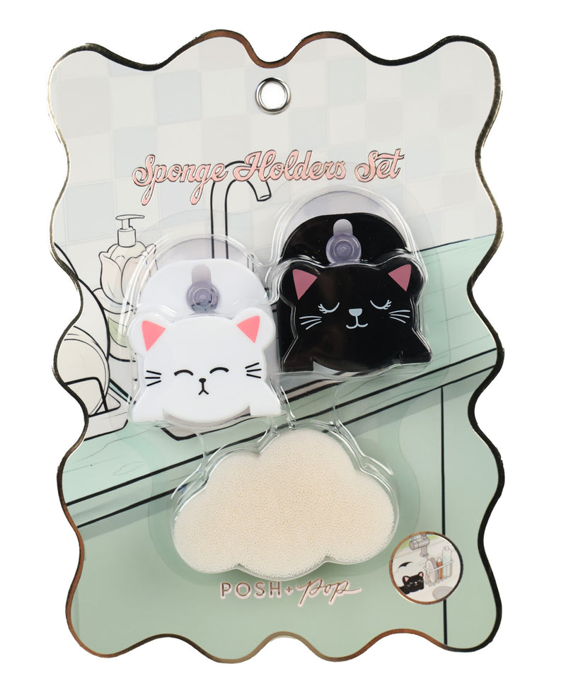 A POSH Pop Sponge Holder Set in its original packaging, featuring two cat-shaped sponge holders (one white with pink ears, one black with pink ears) and a cloud-shaped beige sponge on a decorative card.