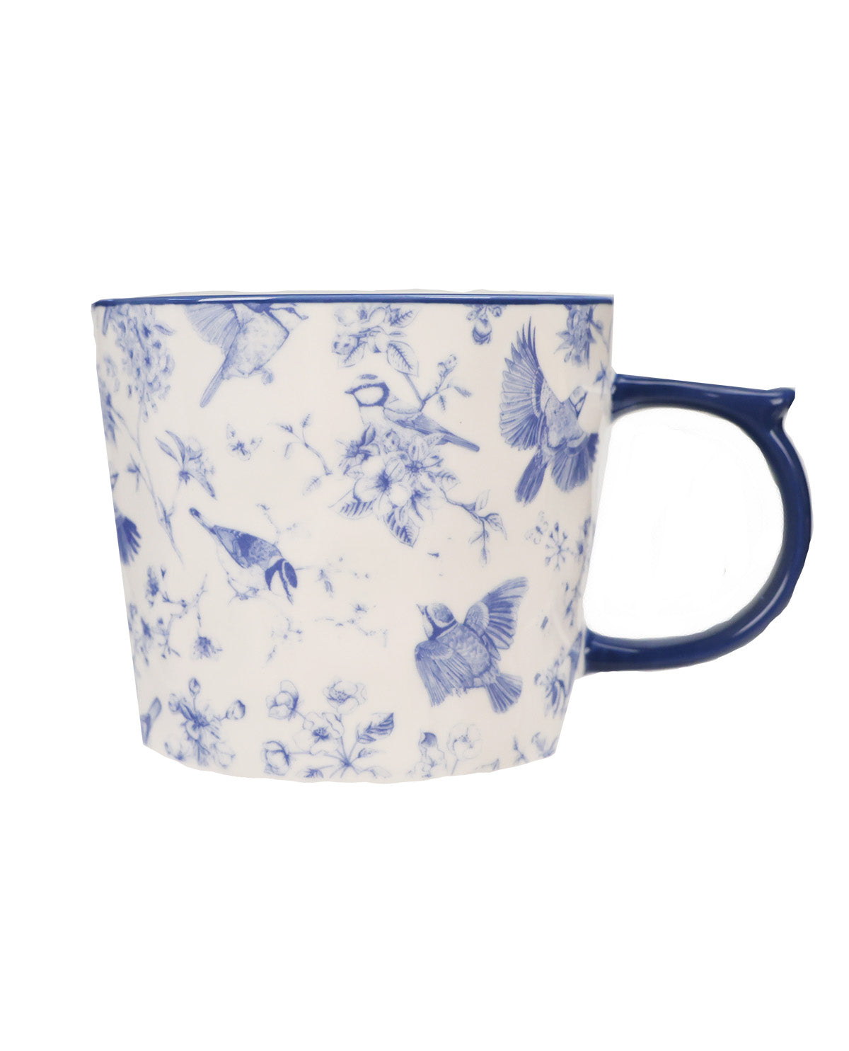 A white ceramic mug with a blue floral and bird pattern, featuring a dark blue handle and rim, shown against a plain white background.