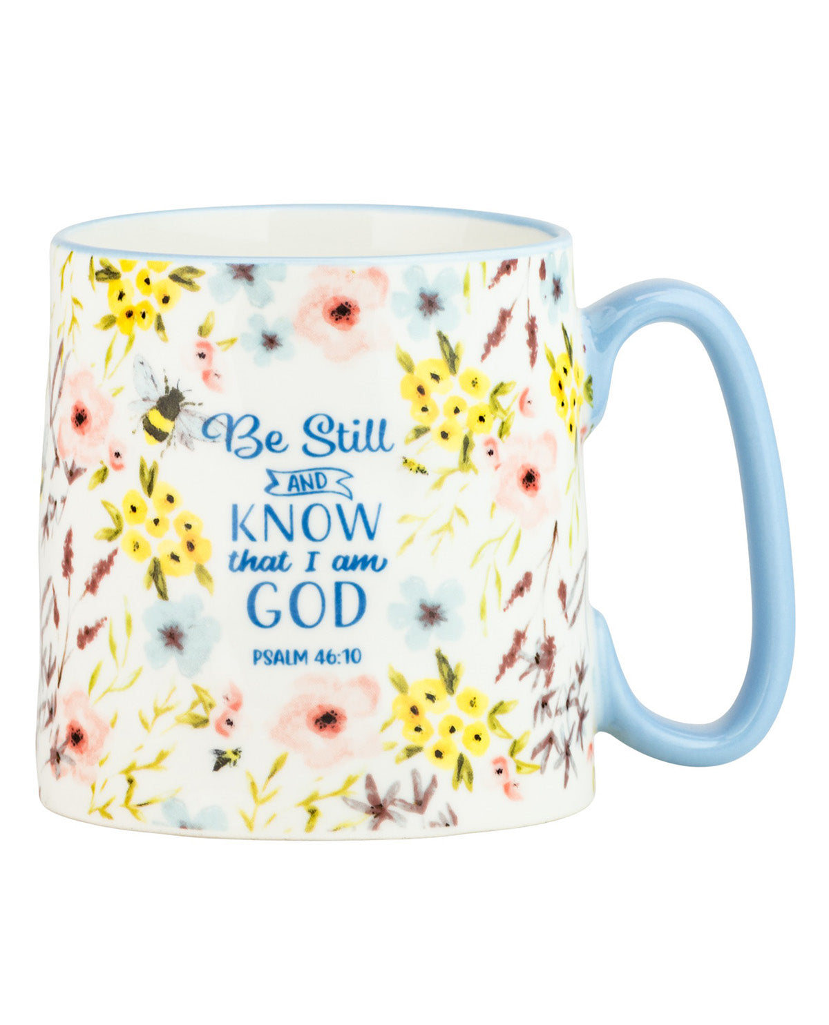 A ceramic coffee mug with a white base decorated with a pastel floral pattern of pink, yellow, and blue flowers. The front features the inspirational Bible verse 'Be Still AND KNOW that I am GOD Psalm 46:10' in blue lettering, and the mug has a light blue handle and interior.