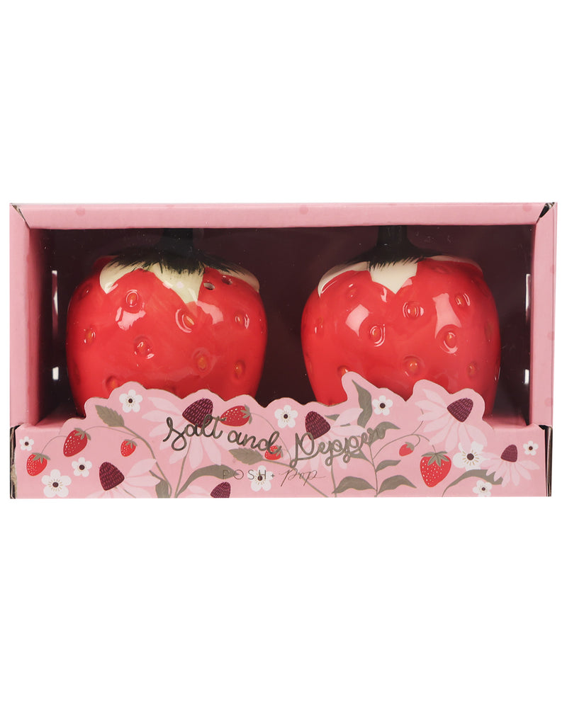 A pair of strawberry-shaped salt and pepper shakers in a pink gift box with floral and strawberry illustrations. The glossy red shakers have white tops and small green stems.