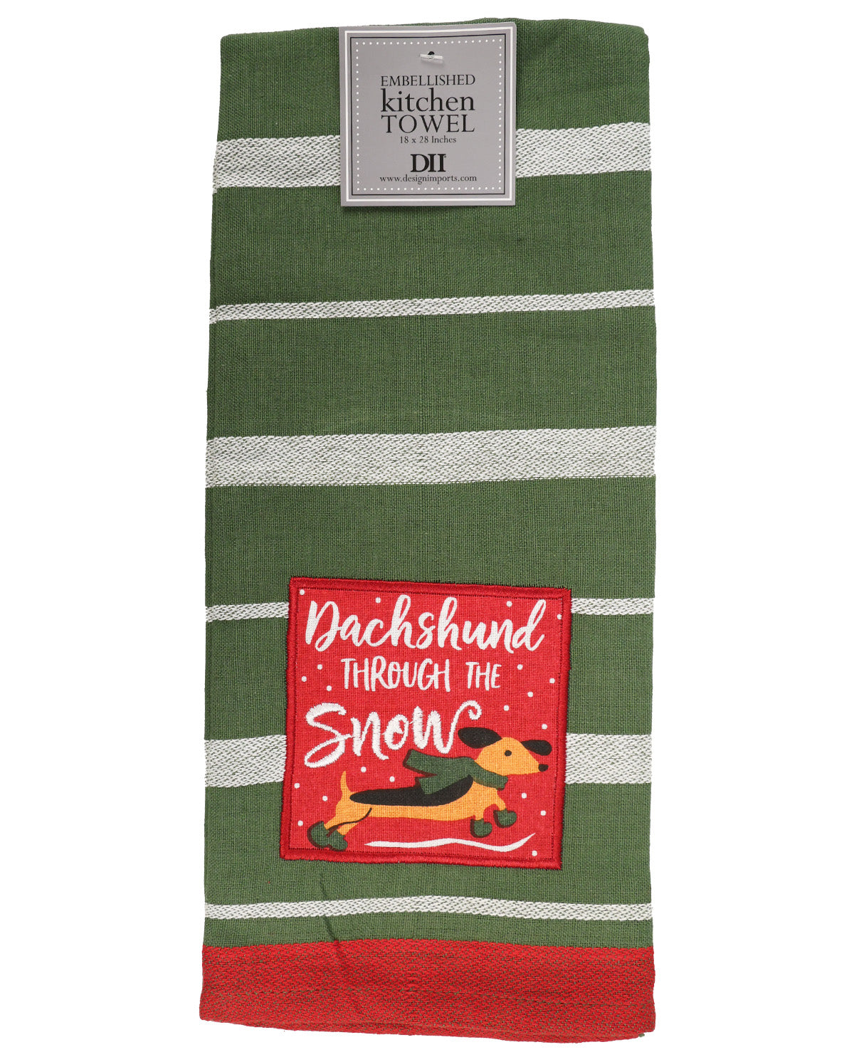 A green kitchen towel with white horizontal stripes, featuring a red square patch that reads 'Dachshund Through the Snow' with a dachshund illustration. A paper label at the top reads 'Dairyshed Kitchen Towel'.