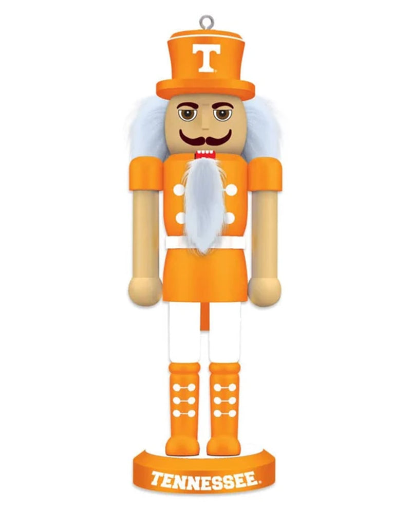 A Tennessee Volunteers nutcracker figurine in bright orange and white, featuring a wooden face with a mustache, a white beard, and a white 'T' on an orange hat, standing on a base labeled 'TENNESSEE'.