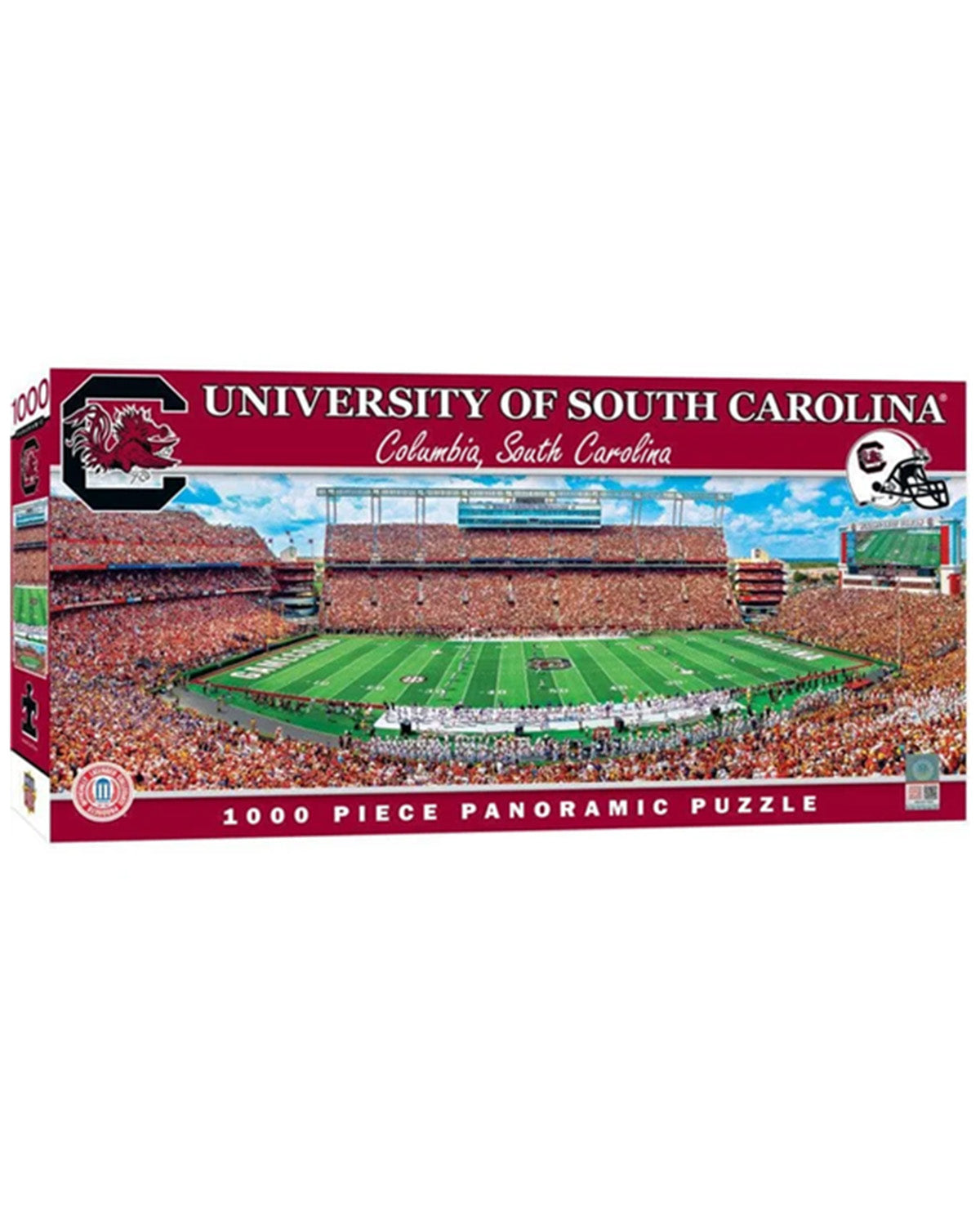 A 1000-piece panoramic jigsaw puzzle box for the University of South Carolina, featuring a vibrant graphic of a football stadium filled with fans on a green field.