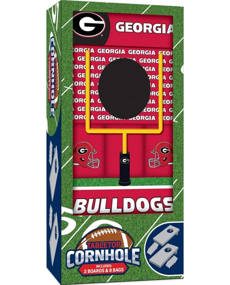 Georgia Bulldogs branded cornhole board packaging, showing a red box with team graphics, football field design, and a visible black cornhole board inside.