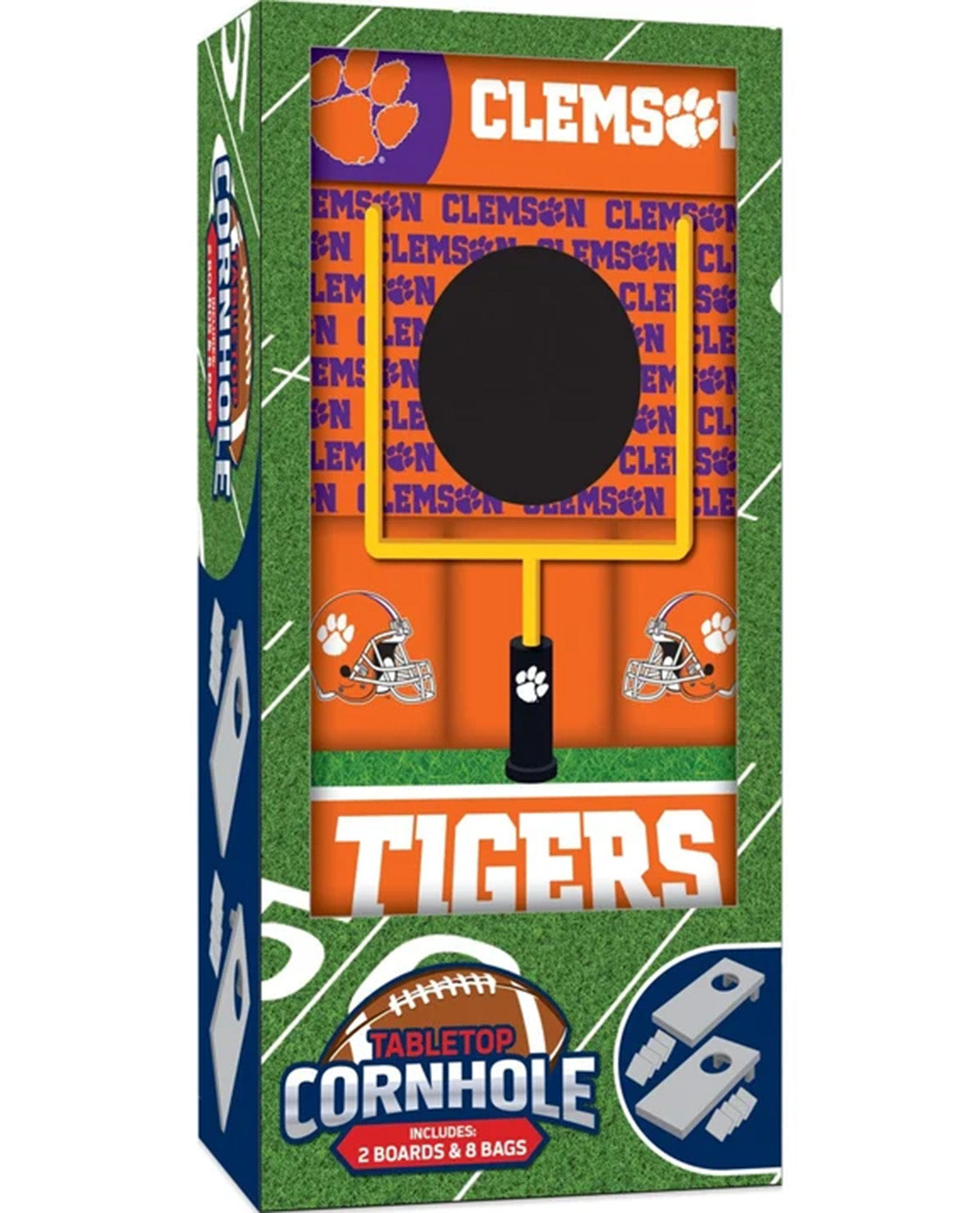 Clemson Tigers themed tabletop cornhole game in retail packaging, featuring a football-field pattern with orange, purple, green, white, and black graphics. The box shows the Clemson logo, wordmark, football helmet and paw print motifs, and a front window displaying the game components.