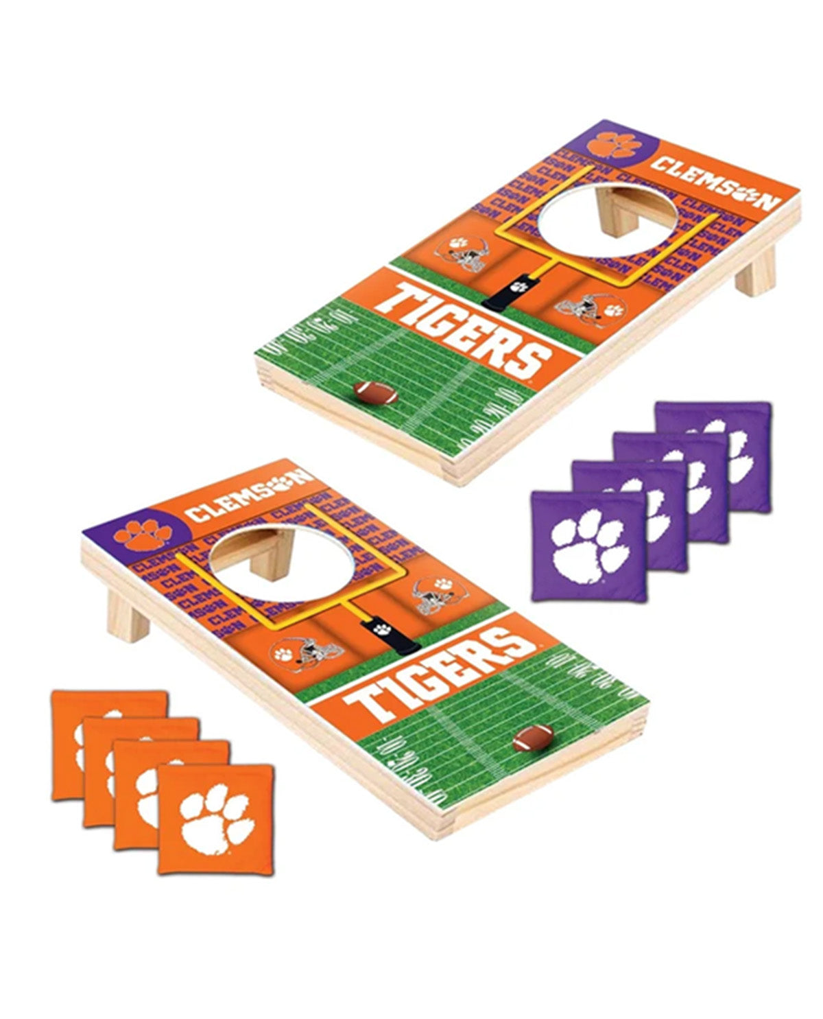 Clemson Tigers cornhole set with two wooden boards, orange and green football field graphics, and four purple square tokens with white paw prints, shown on a white background.