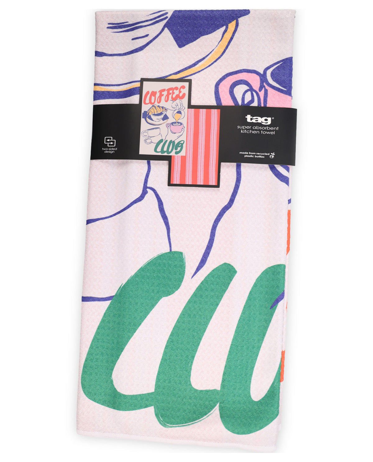 A light pink waffle-weave kitchen towel with a colorful abstract graphic print, featuring a black paper band with the brand 'tag' and a 'COFFEE CLUB' graphic.