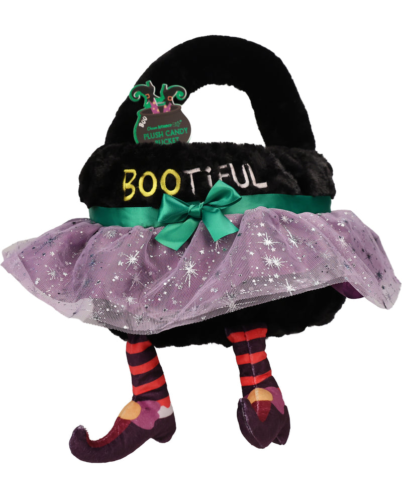 A plush witch hat shaped candy caddy bag with a black fuzzy hat, purple tutu skirt with silver star details, green ribbon and bow, striped legs, and the word 'BOOTYFUL' on the front.