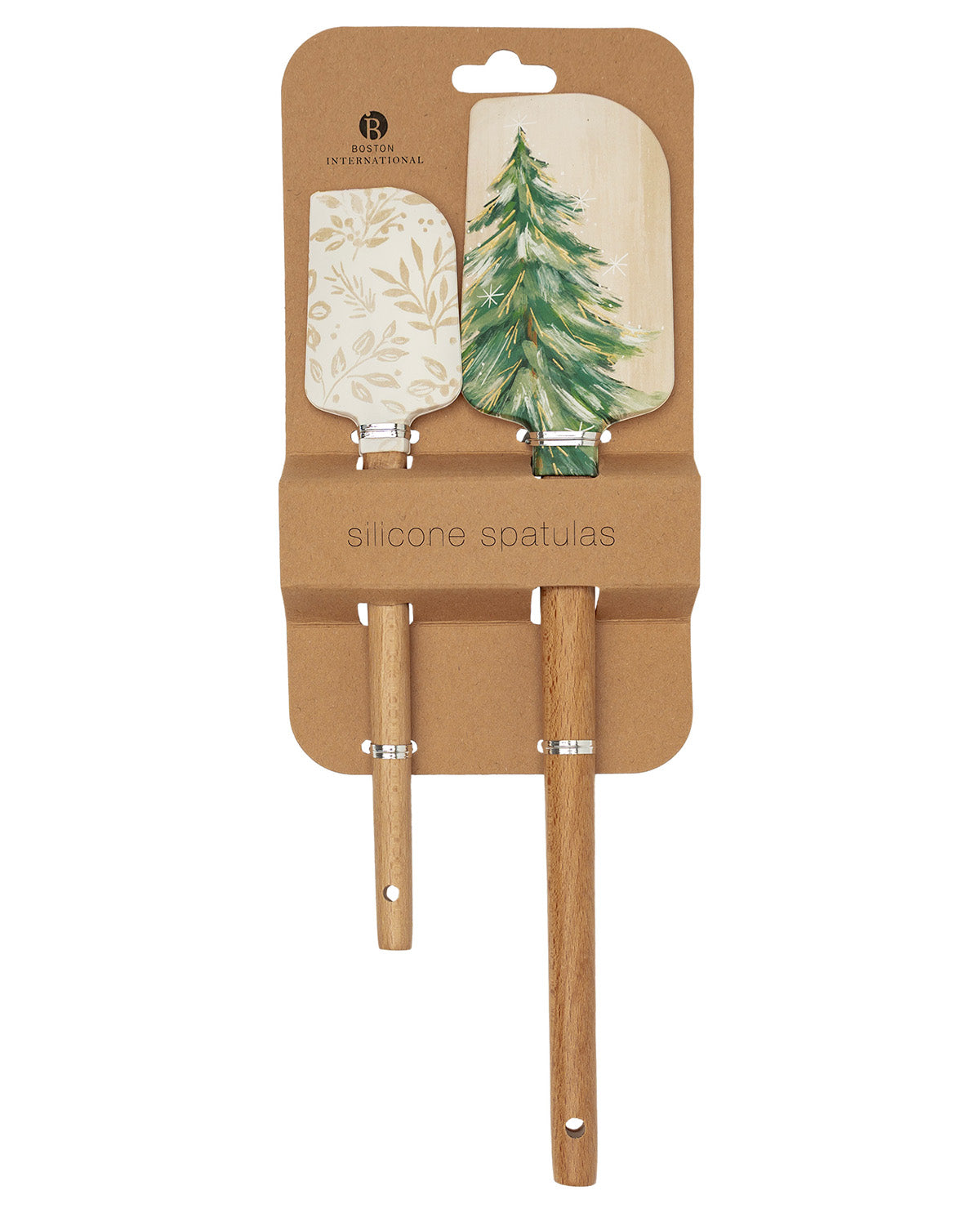 A set of two silicone spatulas with wooden handles, presented on a brown cardboard backing. One spatula has a light beige floral pattern, and the other has a green watercolor pine tree design.