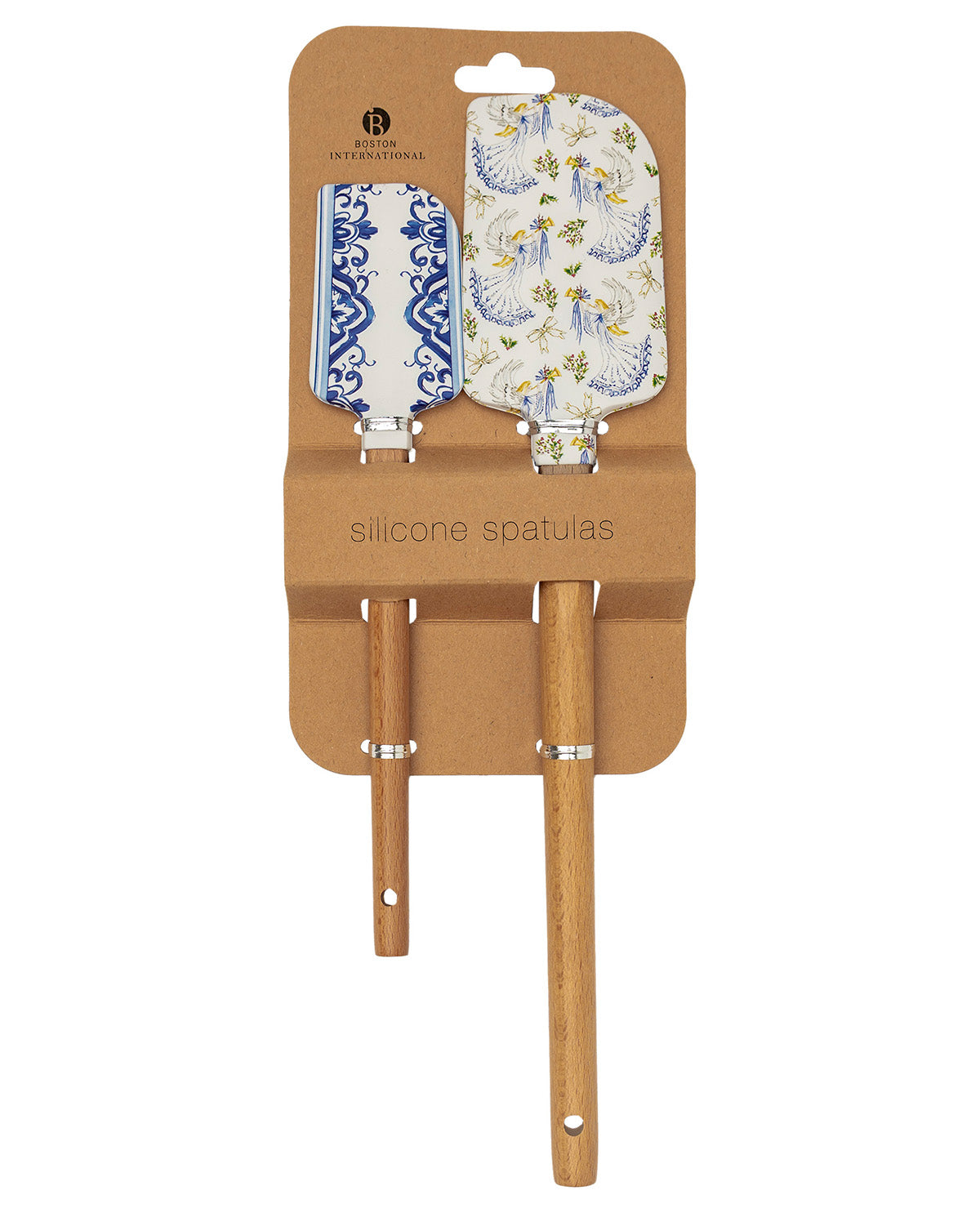 Two silicone spatulas with wooden handles and decorative blades, packaged on a brown cardboard backing. One spatula has a blue and white floral pattern, and the other has a blue and white scroll pattern on a white background.