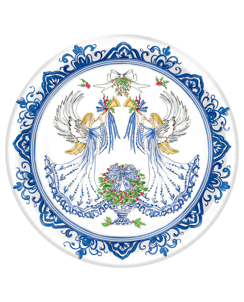 A round white ceramic plate featuring a detailed blue and multicolor illustration of two angels holding bells above a wreath, with an ornate blue border.
