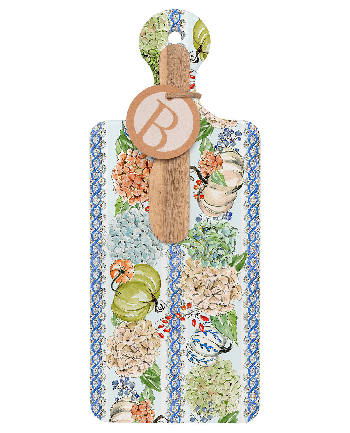 A decorative wooden serving board with a hanging handle, featuring a colorful botanical and fruit pattern in blue, green, orange, and cream, with a round wooden monogrammed tag attached.