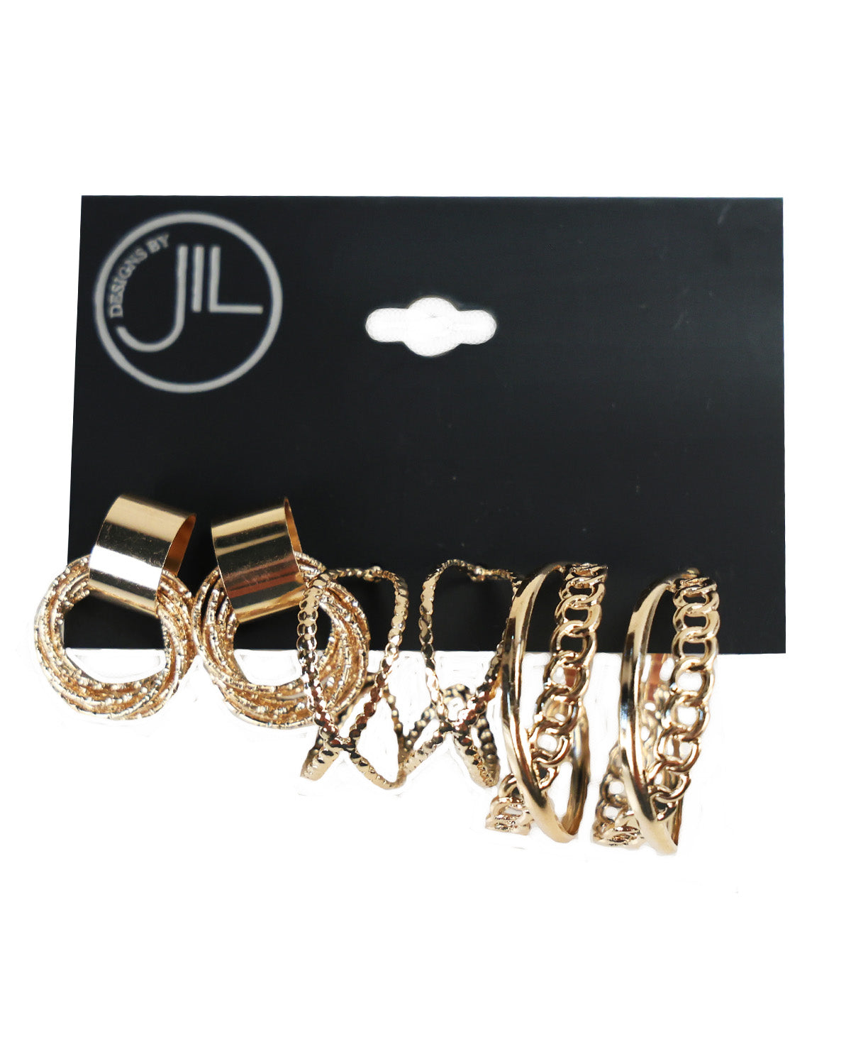 A set of gold-toned stacked rings with textured and chain-like patterns, displayed on a black hanging card with the brand logo 'JIL'.