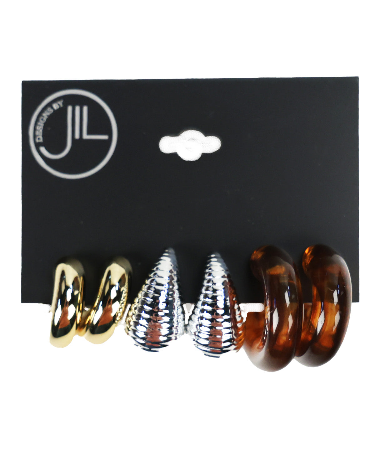 Three pairs of spiral hoop earrings displayed on a black backing card. The left pair is metallic gold, the middle pair is metallic silver with a textured pattern, and the right pair is translucent amber brown.