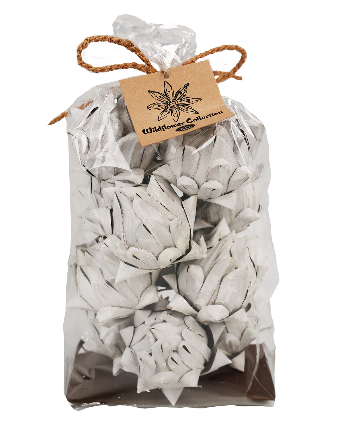 A clear plastic bag filled with white artificial flower petals or faux blossoms, tied with a brown twine bow and a kraft paper tag that reads 'Wildflower Collections,' on a white background.