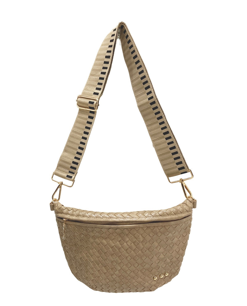 A woven beige crossbody bag with a matching adjustable woven strap featuring black stripes, gold-tone hardware, and a small gold logo on the front.